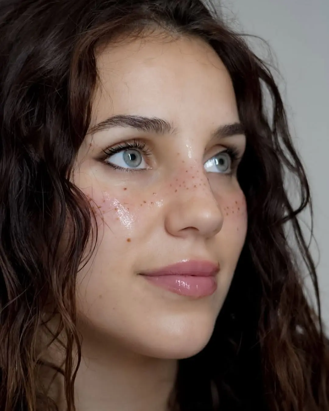 Natural freckle tattoos enhance youthful beauty