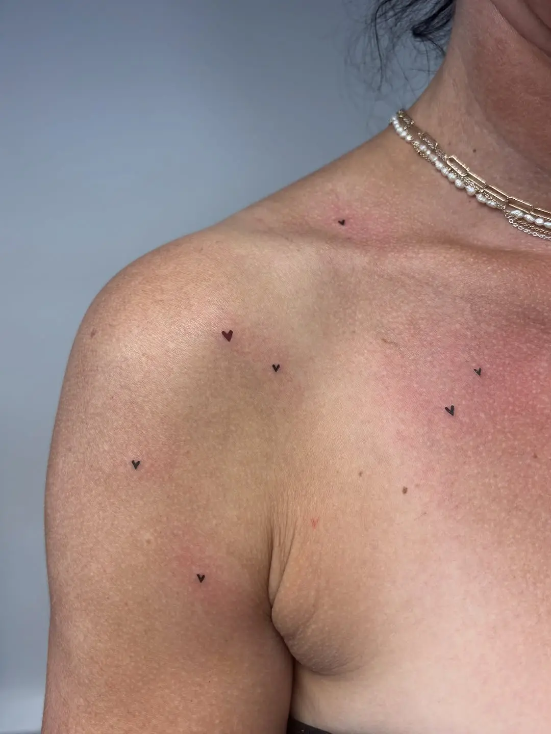 Charming Heart-Shaped Freckle Tattoos for a Unique Look