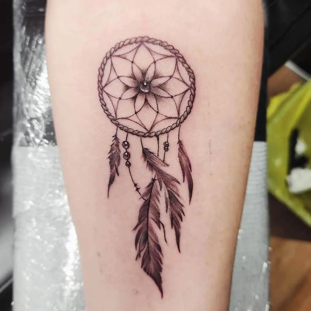 Elegant dreamcatcher tattoo with detailed feathers