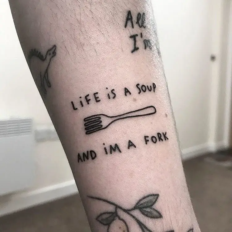 Unique fork tattoo with a witty phrase