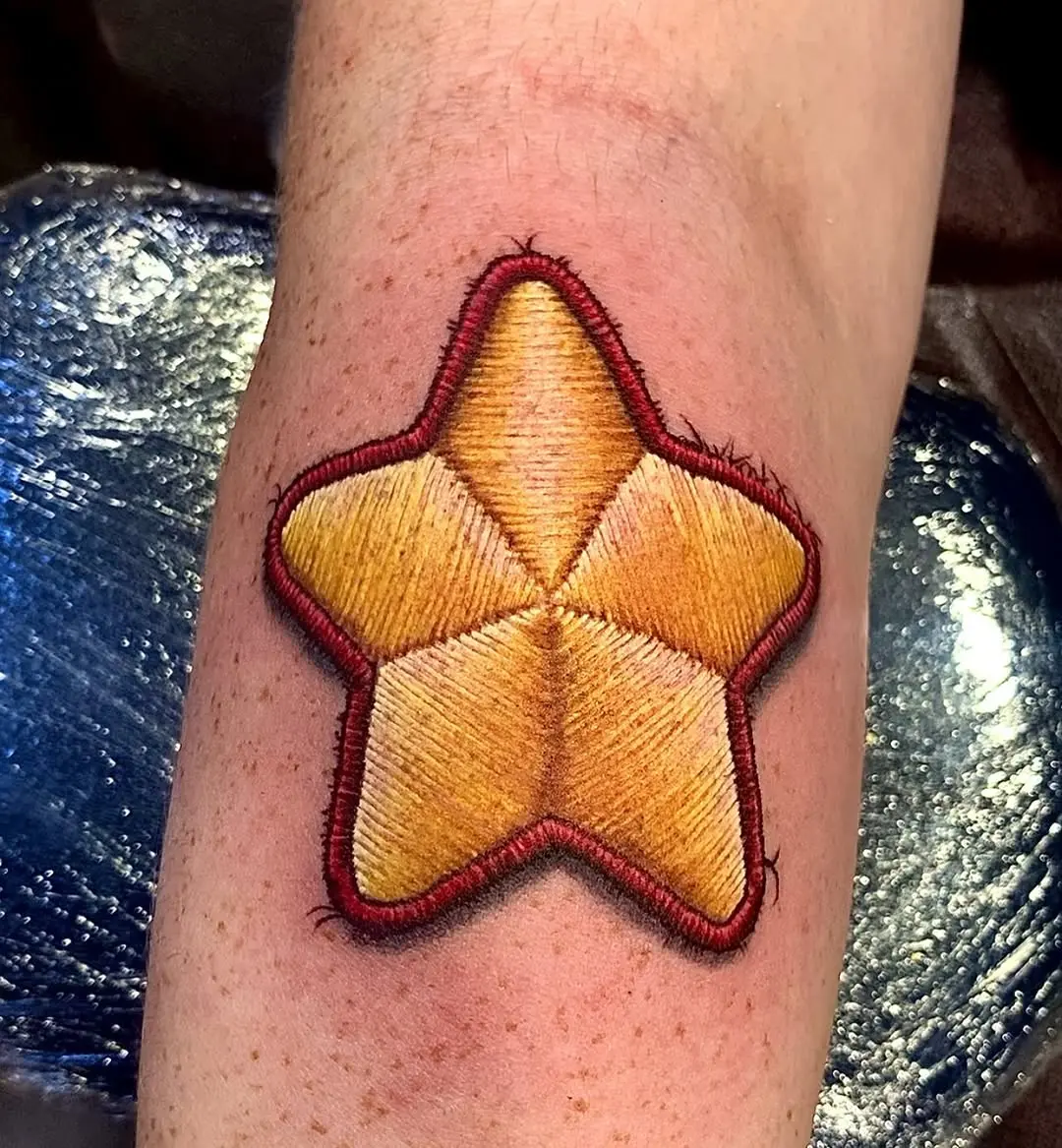 Stunning star tattoo with embroidery effect