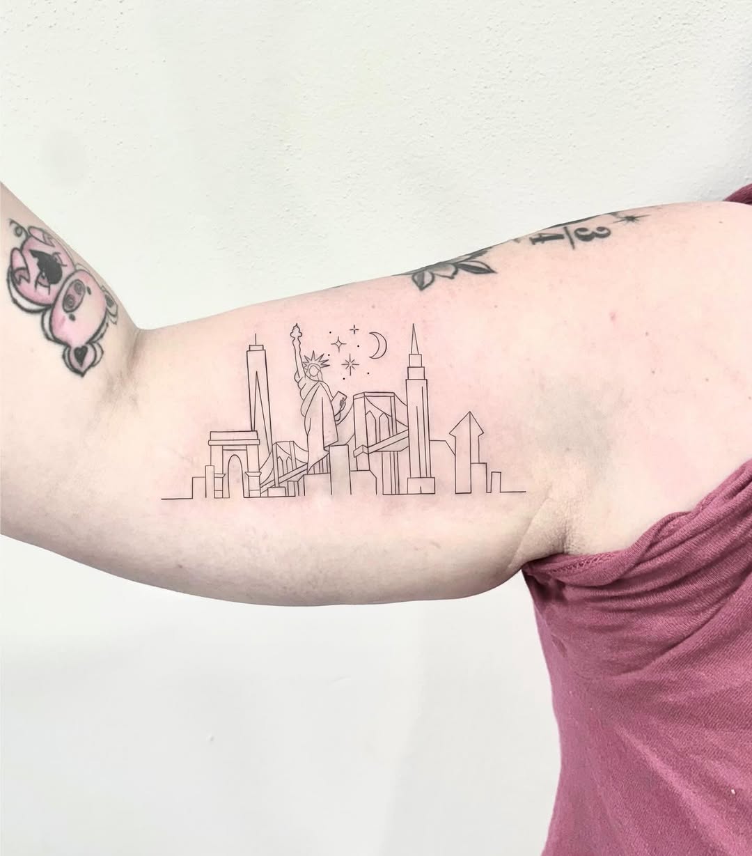 Elegant skyline tattoo featuring iconic landmarks