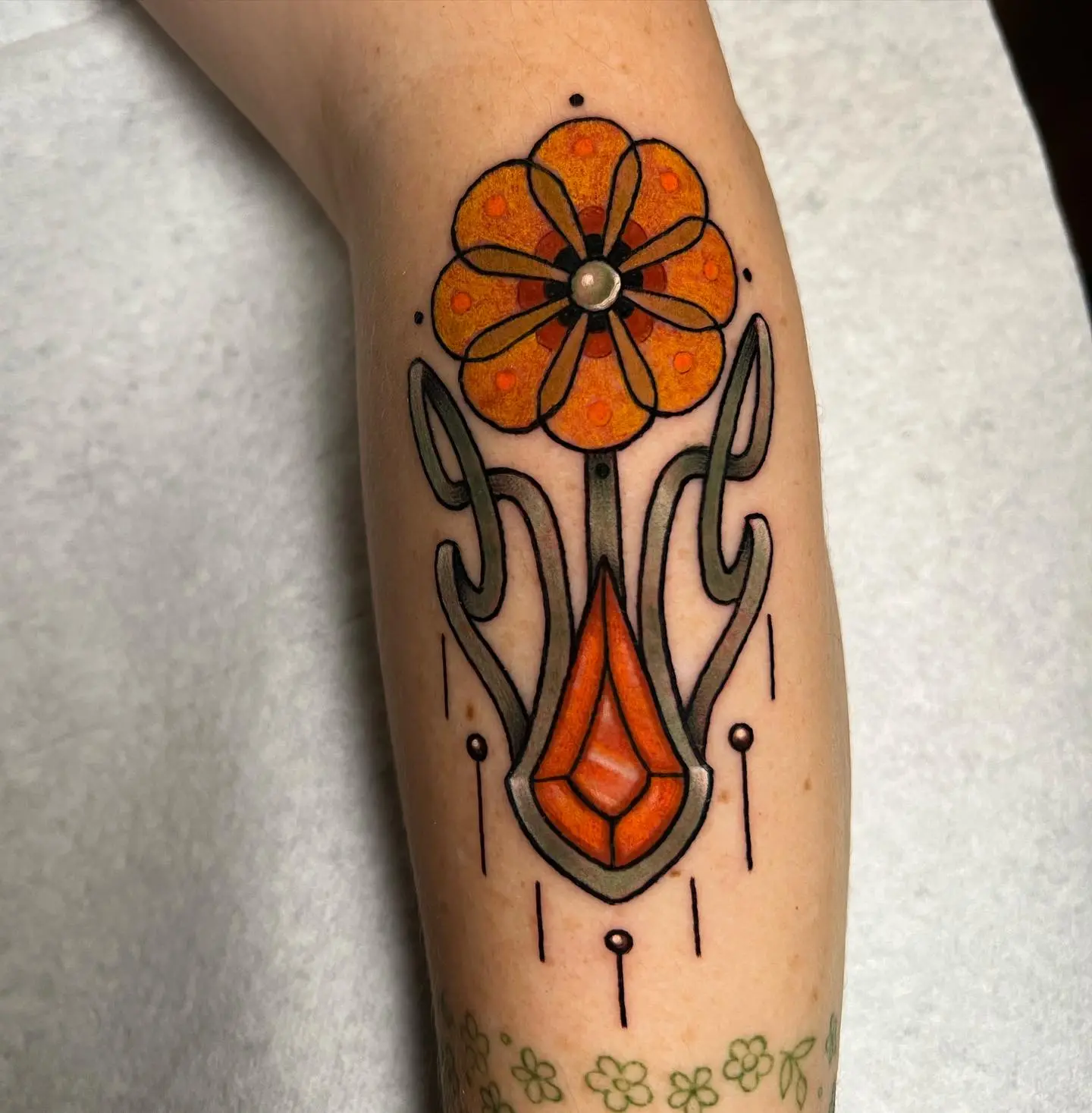 Vibrant art nouveau flower tattoo design
