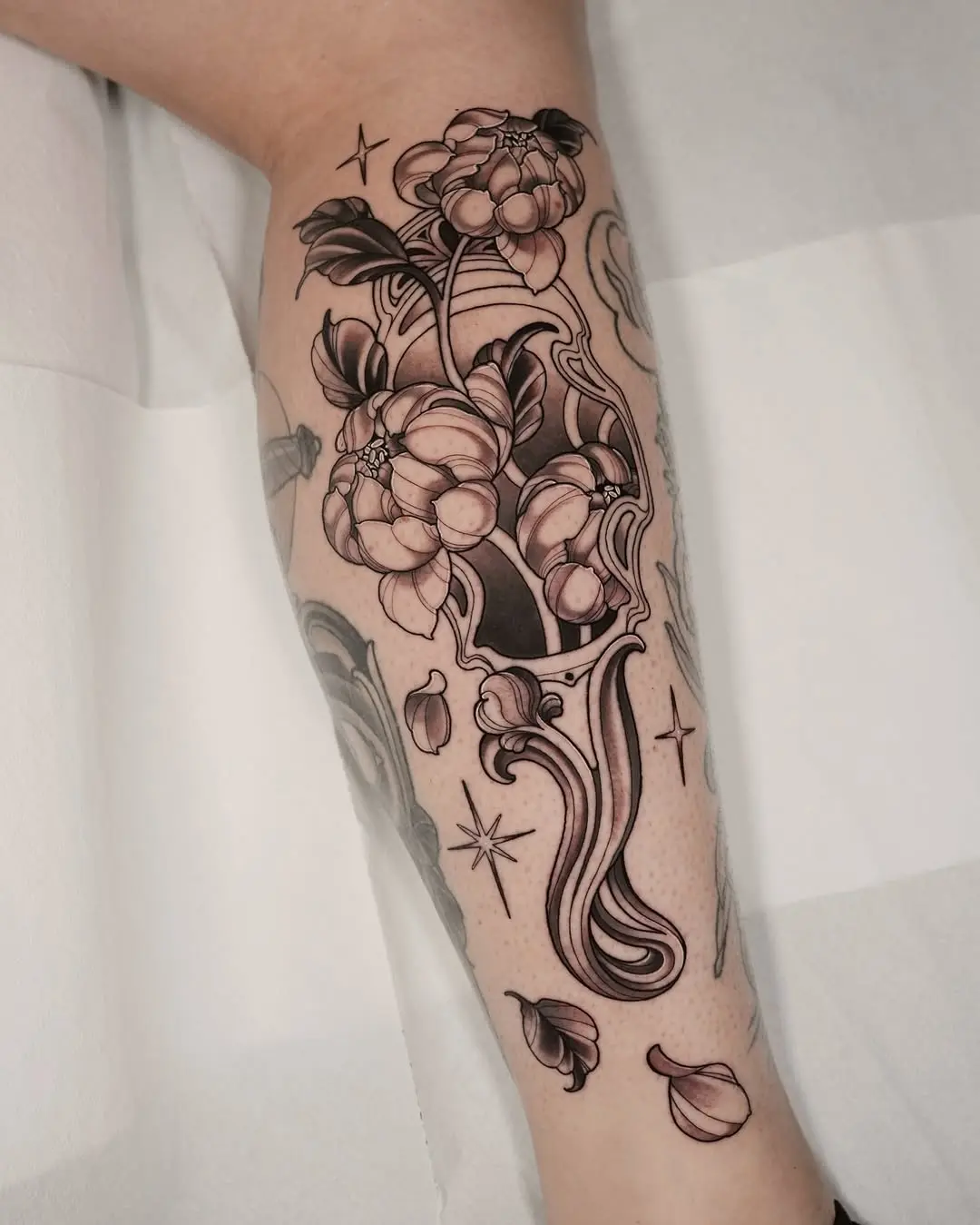Elegant floral tattoo in unique art nouveau style