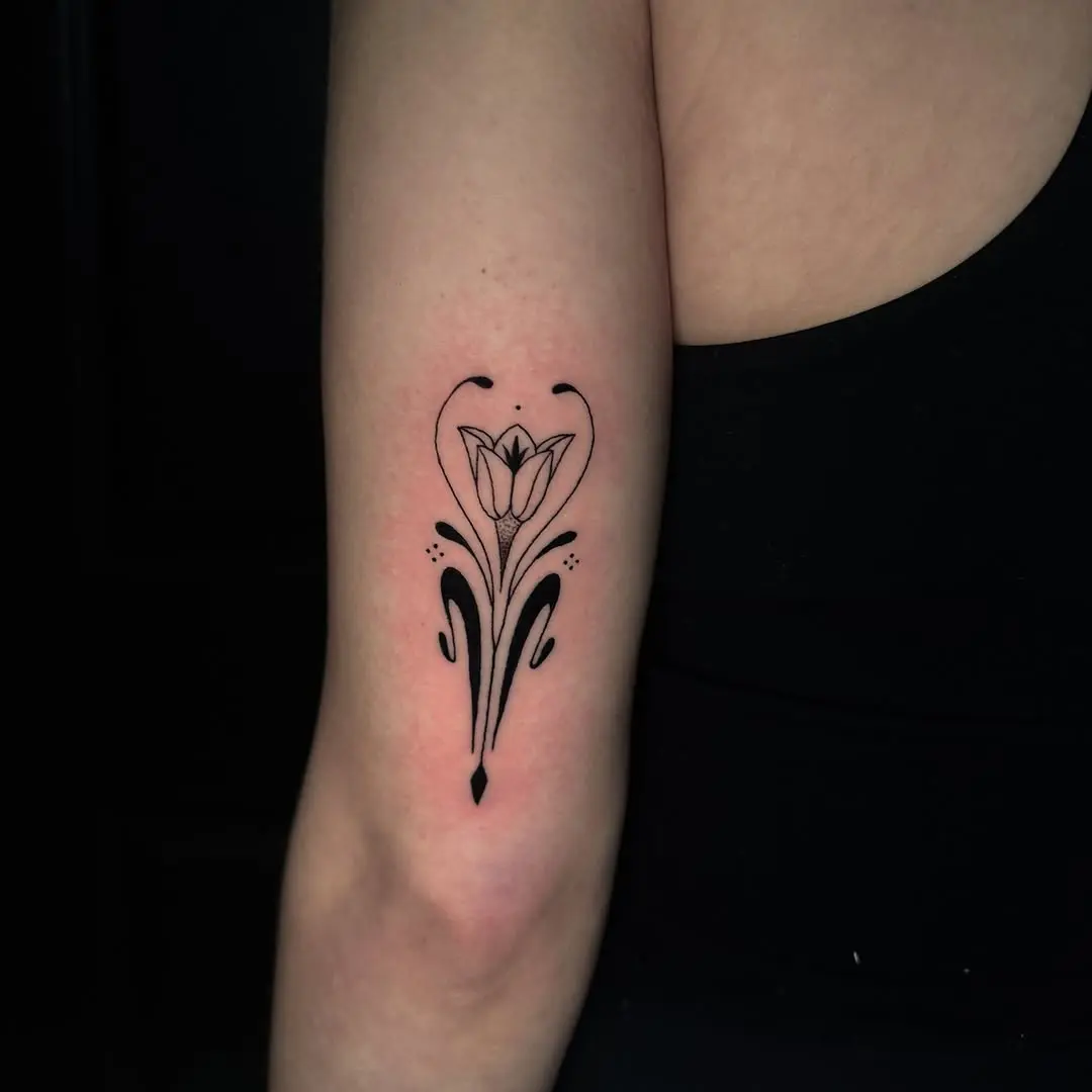 Elegant floral design tattoo with art nouveau flair