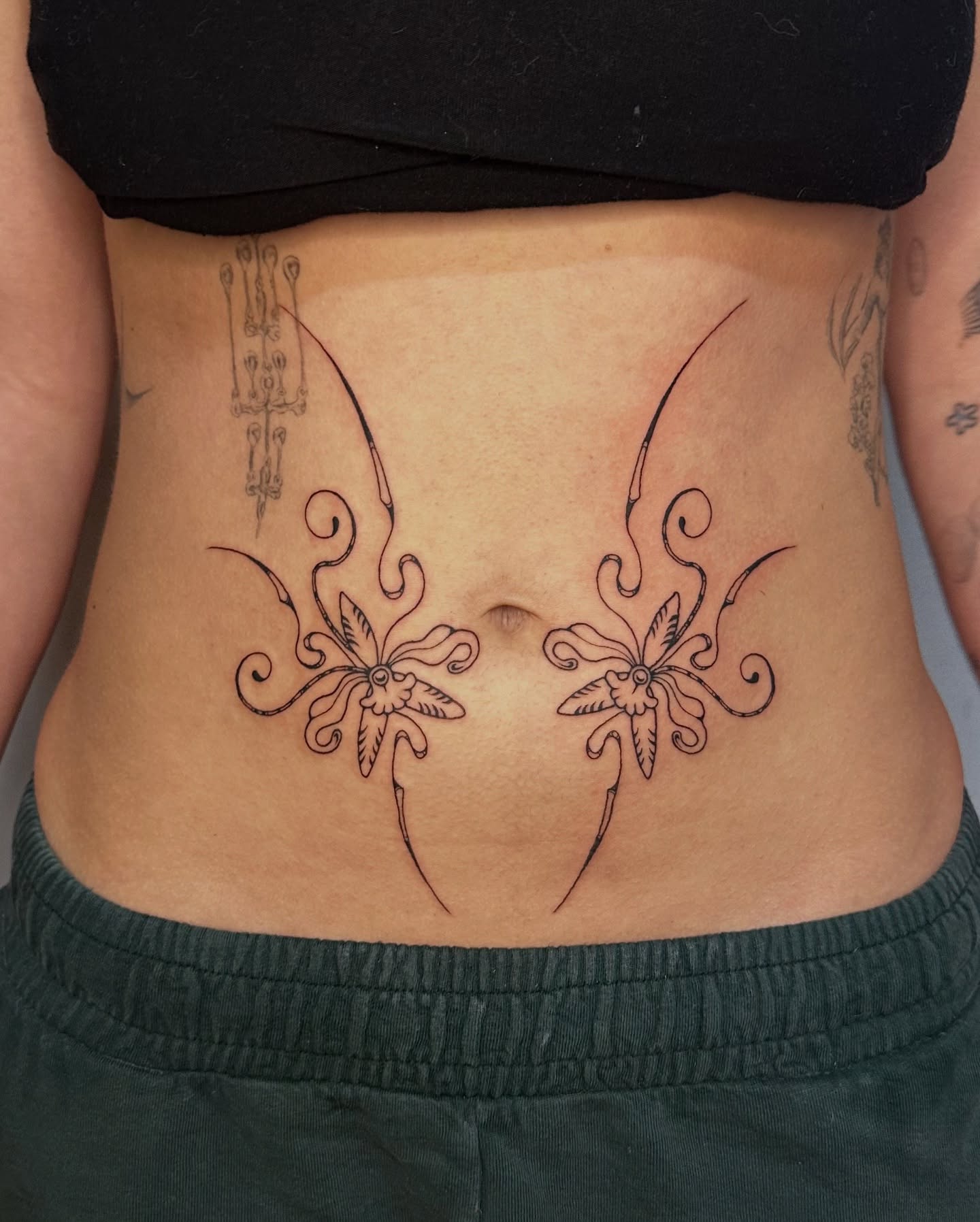 Elegant Art Nouveau Floral Belly Tattoo Design
