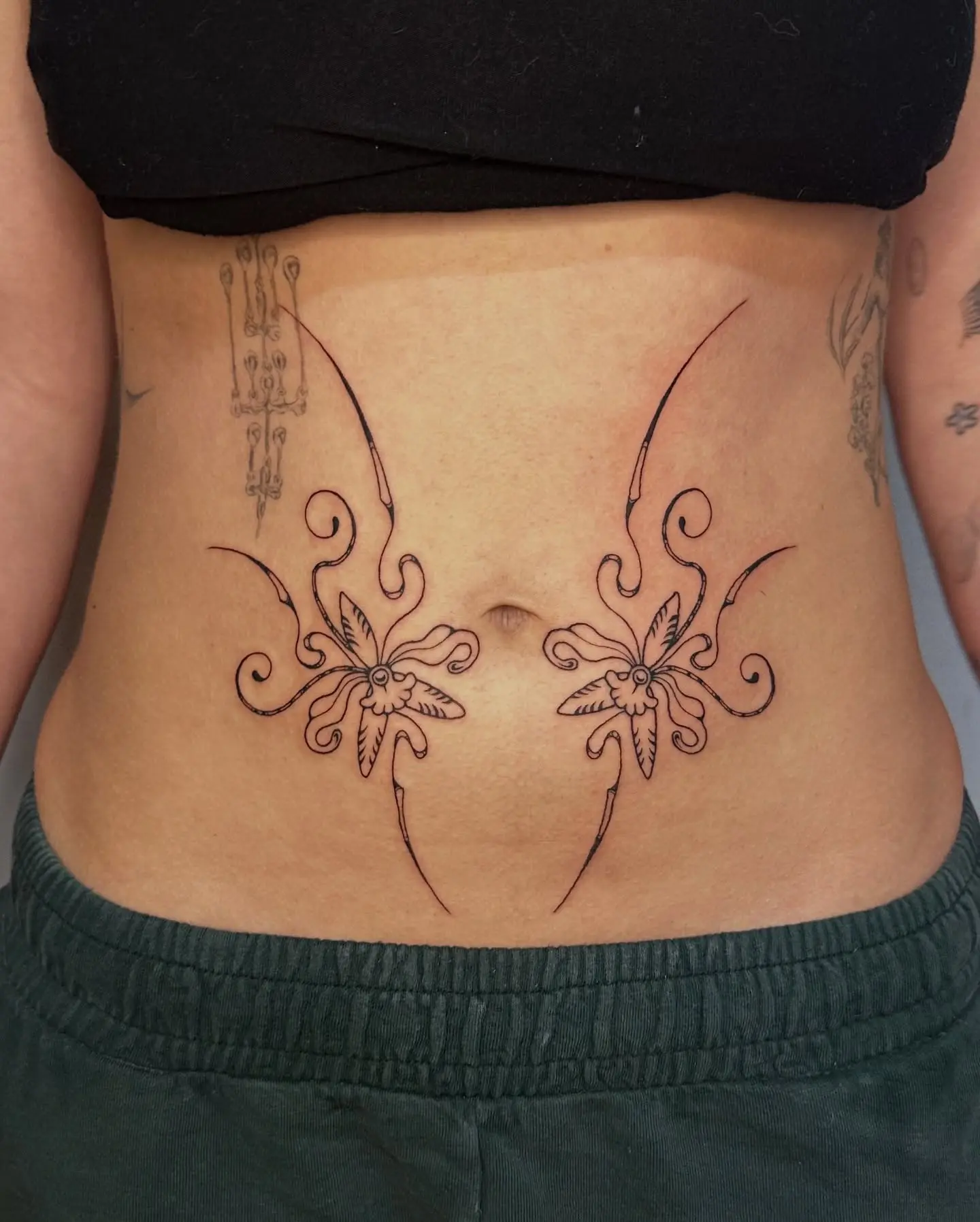 Elegant Art Nouveau Floral Belly Tattoo Design