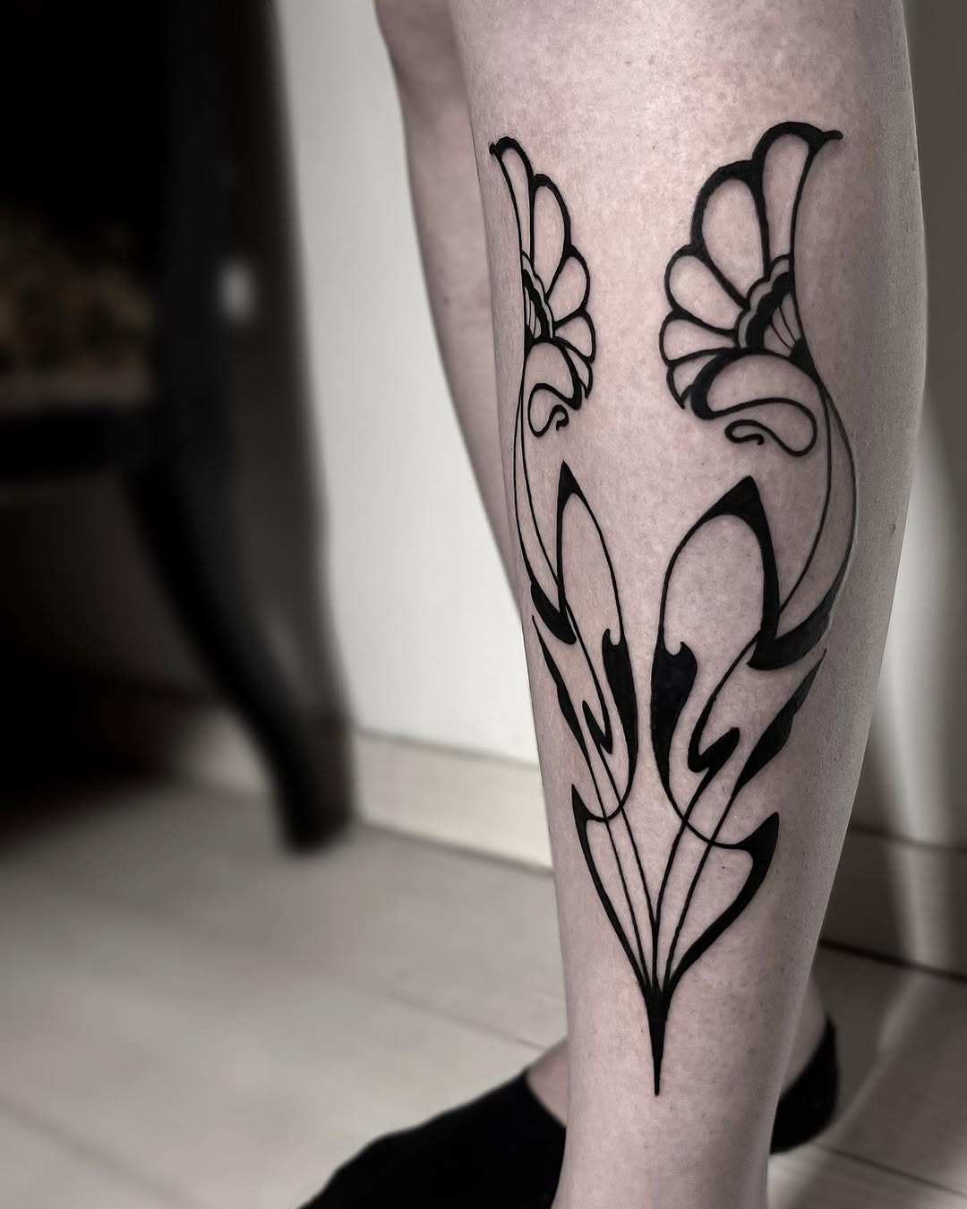 Elegant Black Floral Art Nouveau Tattoo