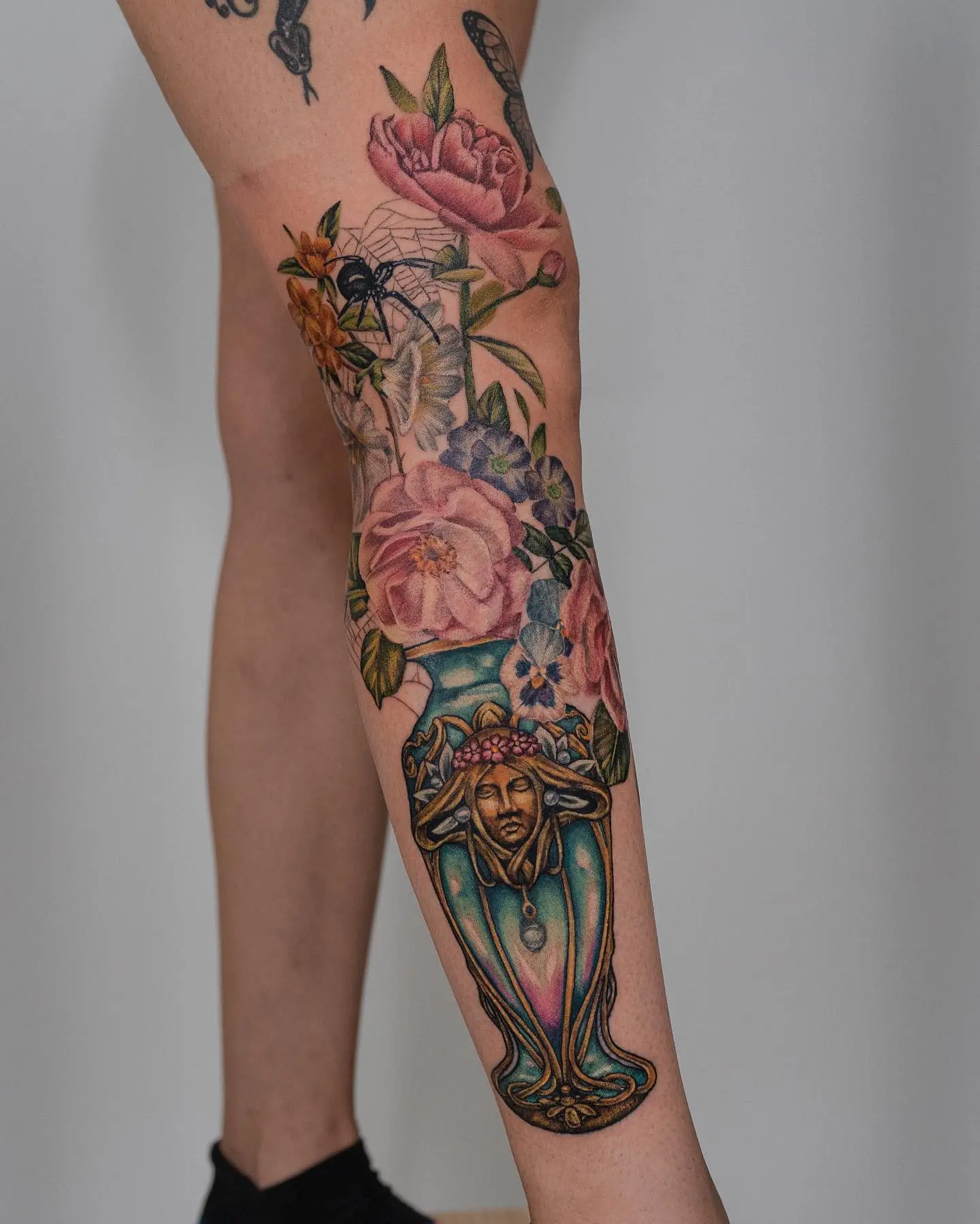 Stunning art nouveau floral leg tattoo design