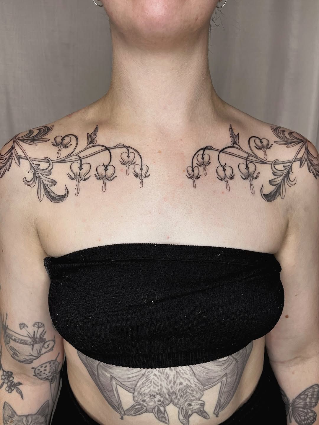 Elegant floral art nouveau tattoos on collarbone