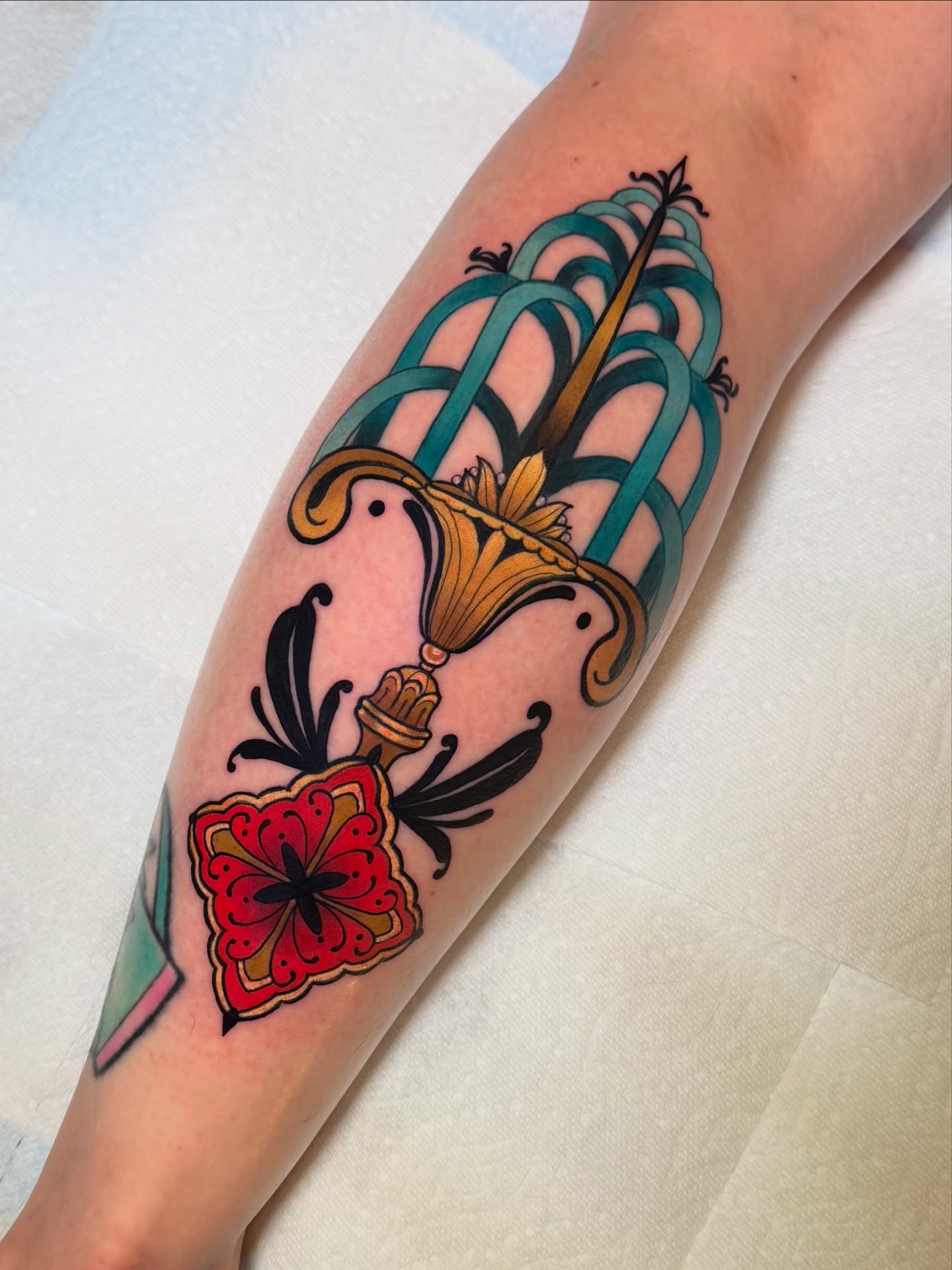 Elegant Art Nouveau Sword and Floral Tattoo
