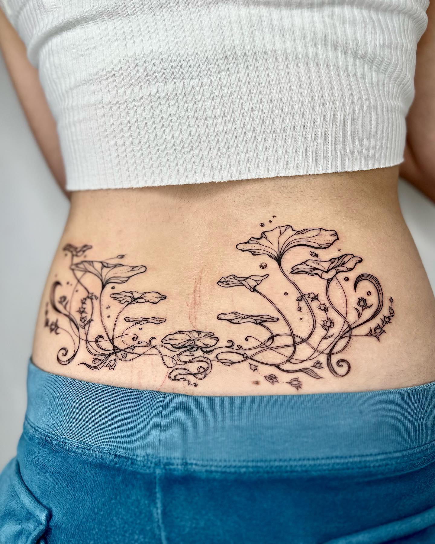 Elegant floral art nouveau tattoo design