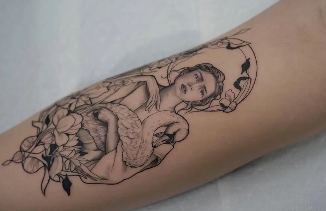 Elegant art nouveau tattoo featuring swan and figure