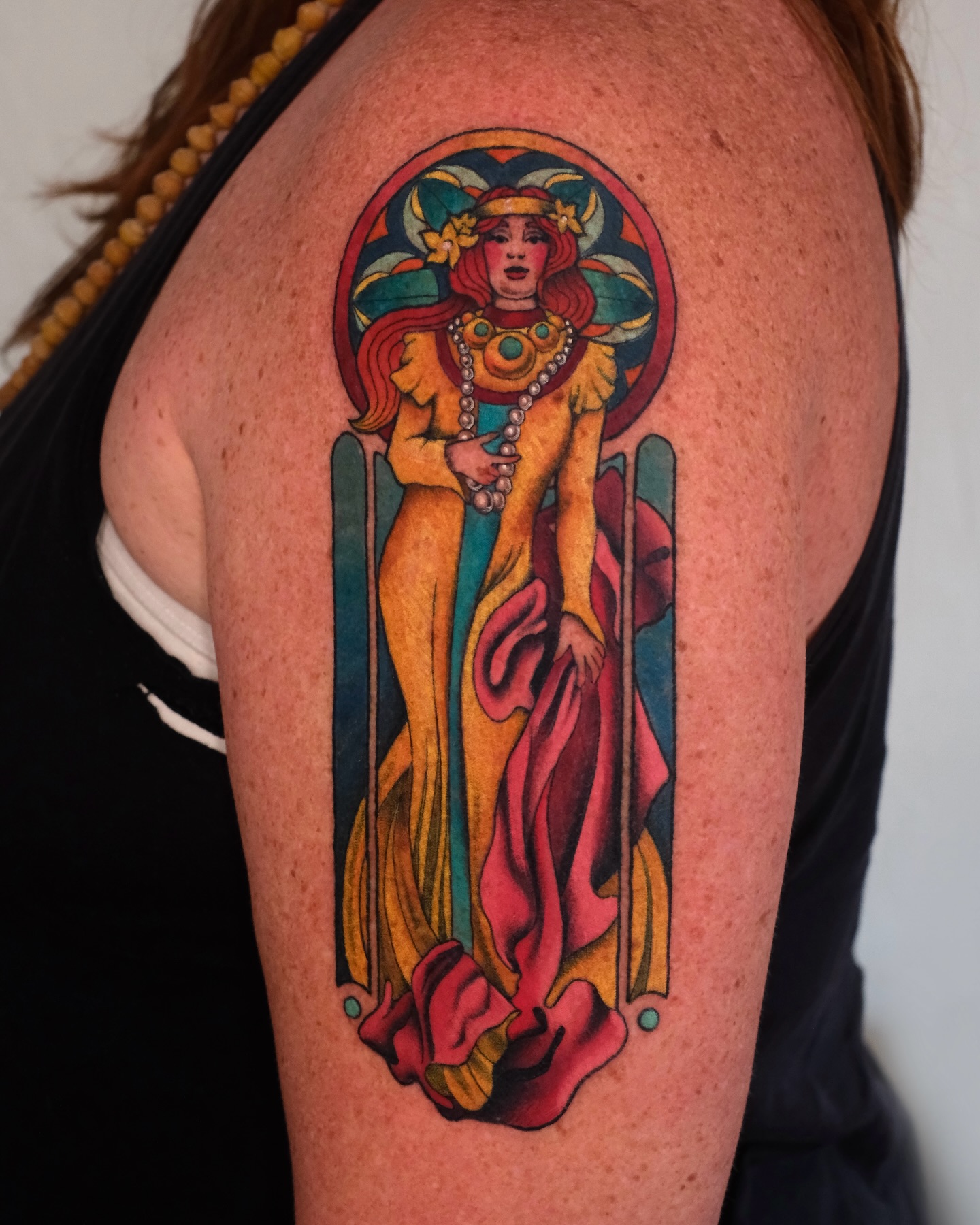 Elegant art nouveau tattoo showcasing feminine grace