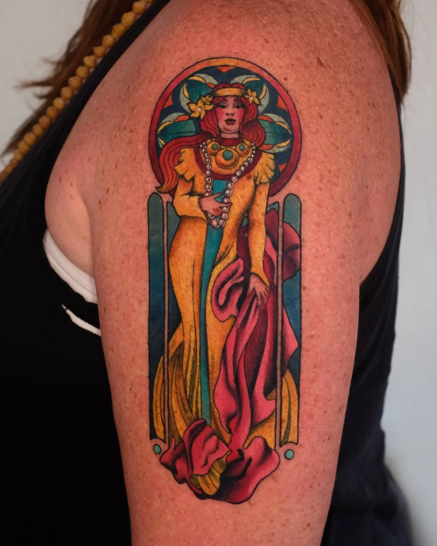Elegant art nouveau tattoo showcasing feminine grace