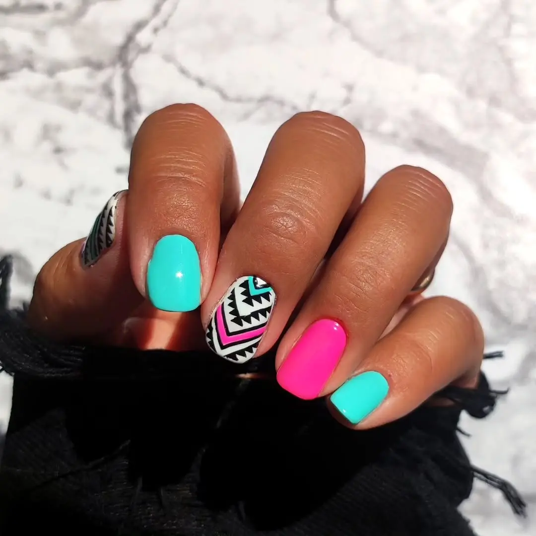 Vibrant Aztec-inspired geometric nail art