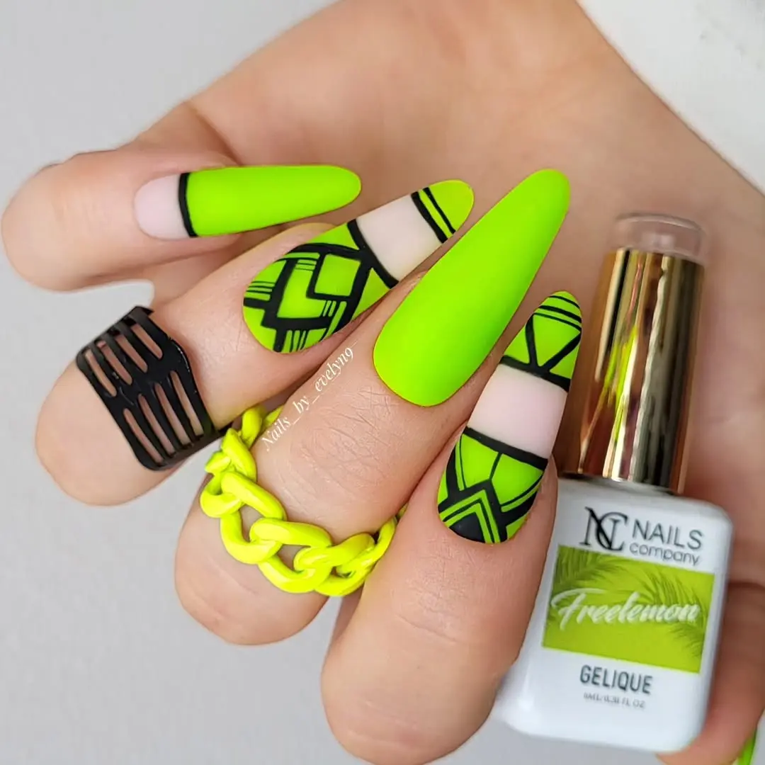 Bold Aztec-inspired green nail art design