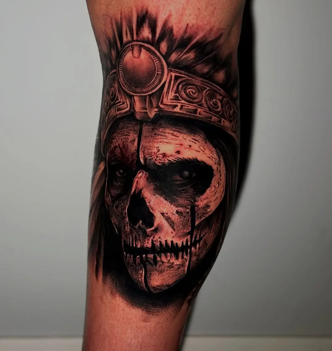 Intricate Aztec skull tattoo with headdress design