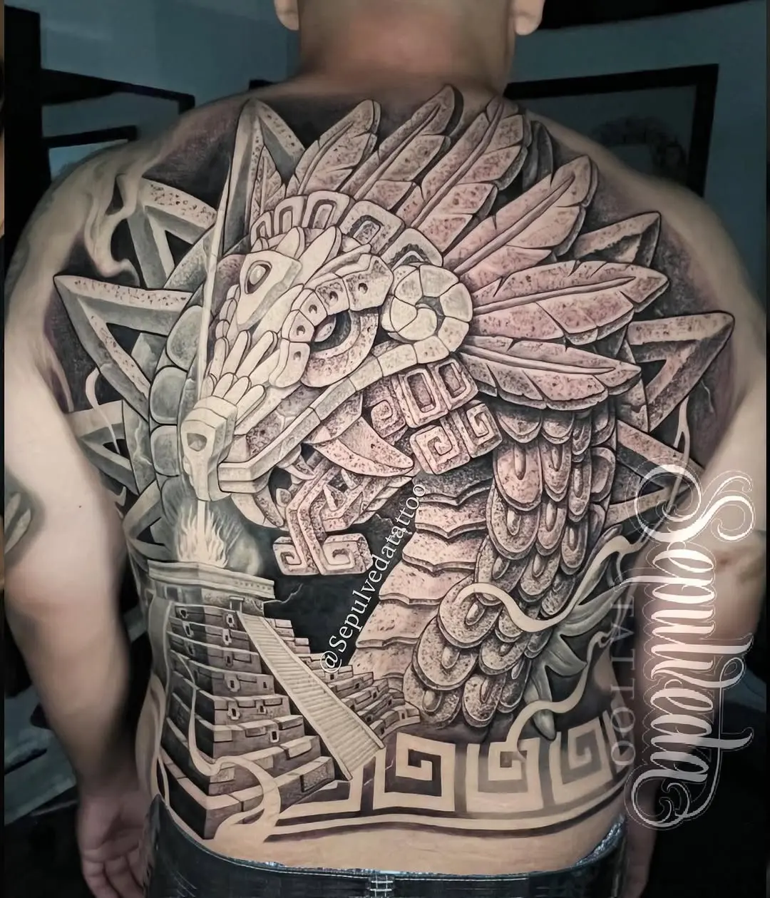 Intricate Aztec Tattoo on Back with Feathered Serpent