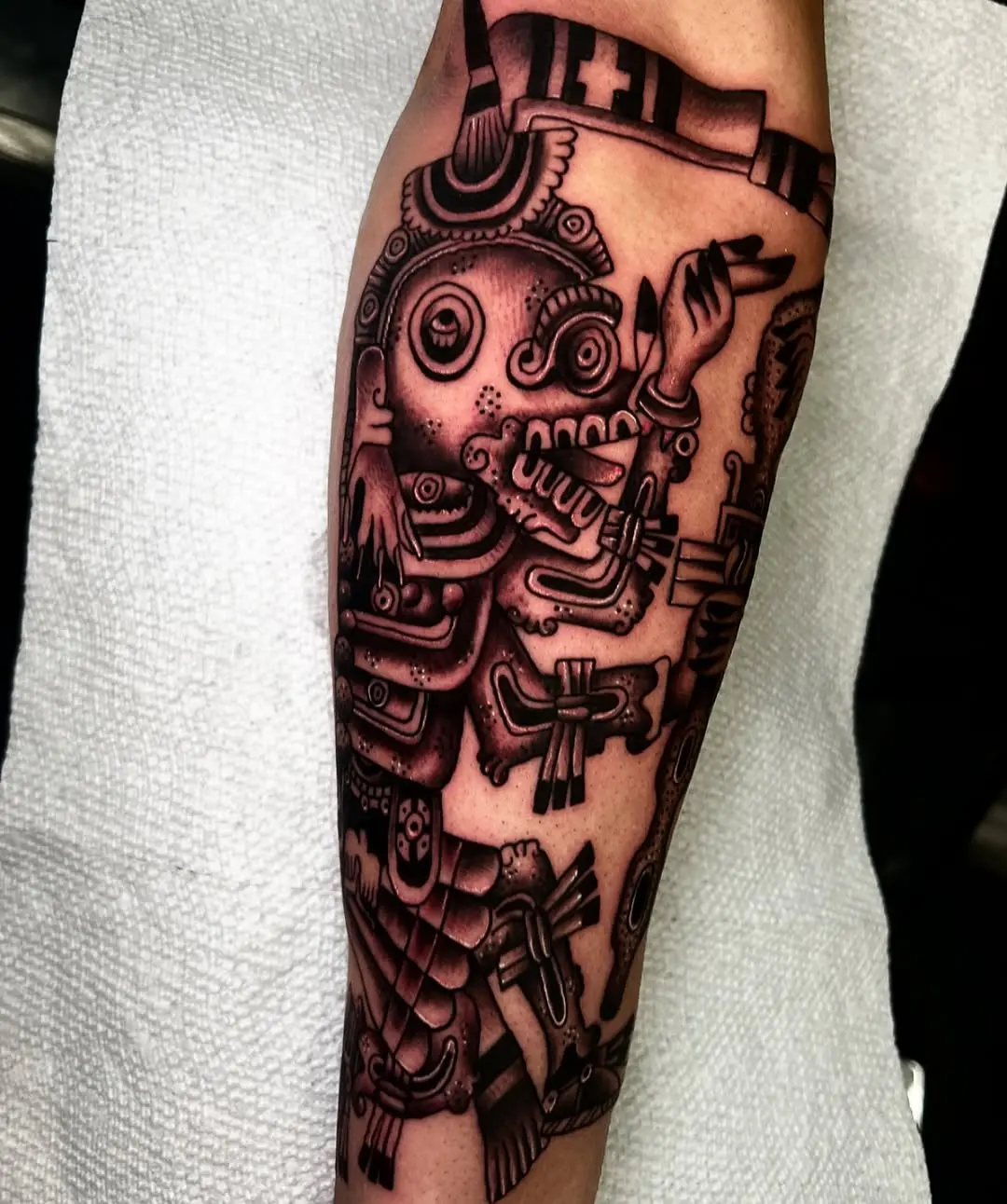 Intricate black and gray Aztec tattoo design