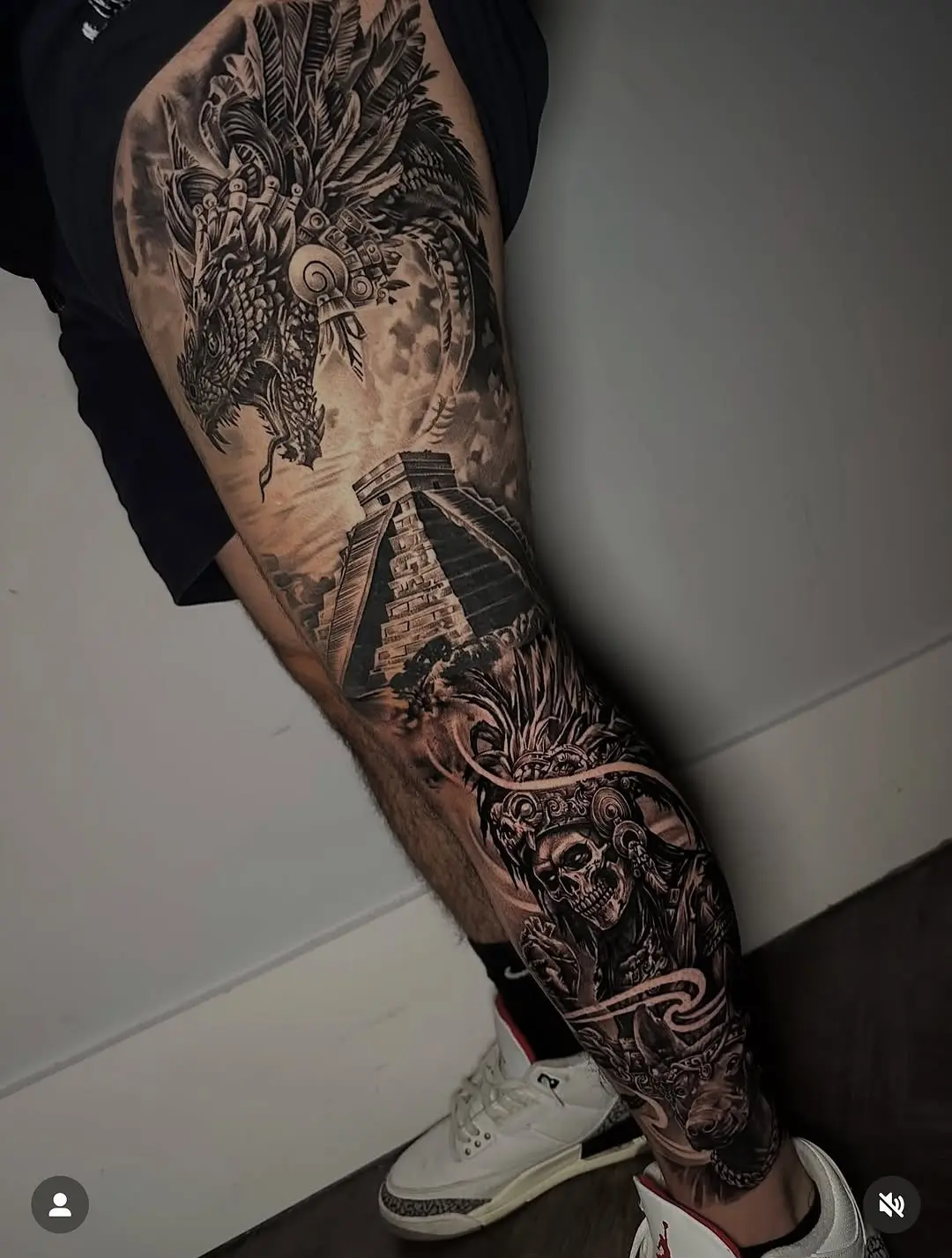 Intricate Aztec-themed full leg tattoo design