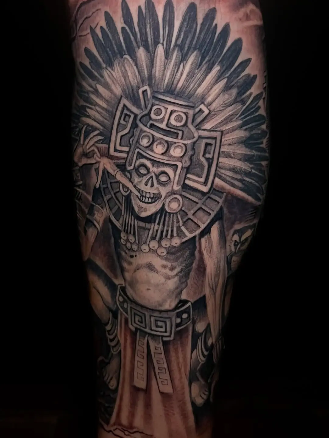 Intricate Aztec-inspired tattoo of a deity