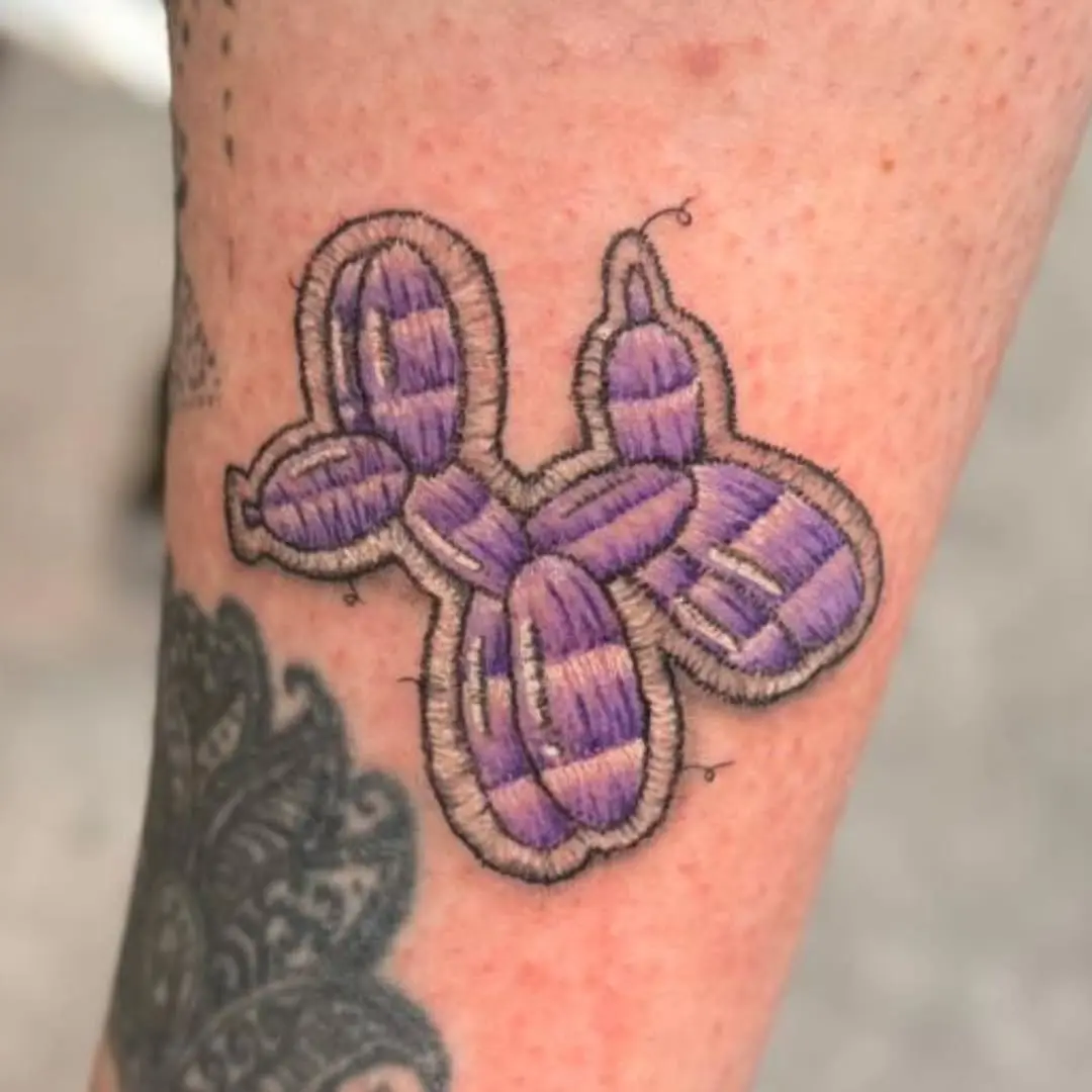 Whimsical balloon animal embroidery tattoo design