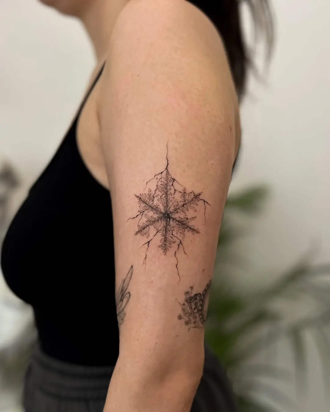 Intricate snowflake tattoo showcasing natural beauty