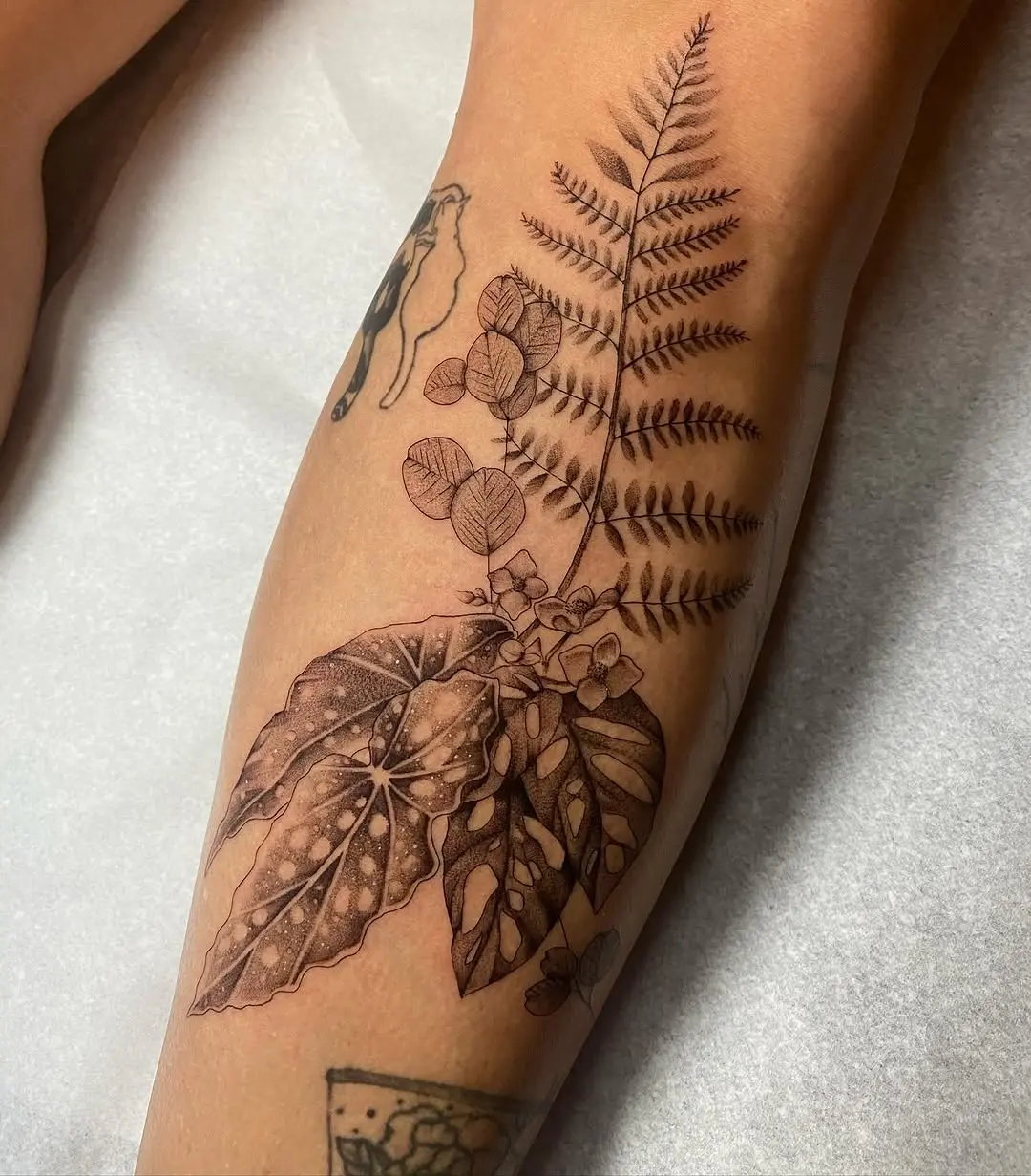 Intricate begonia and fern tattoo design