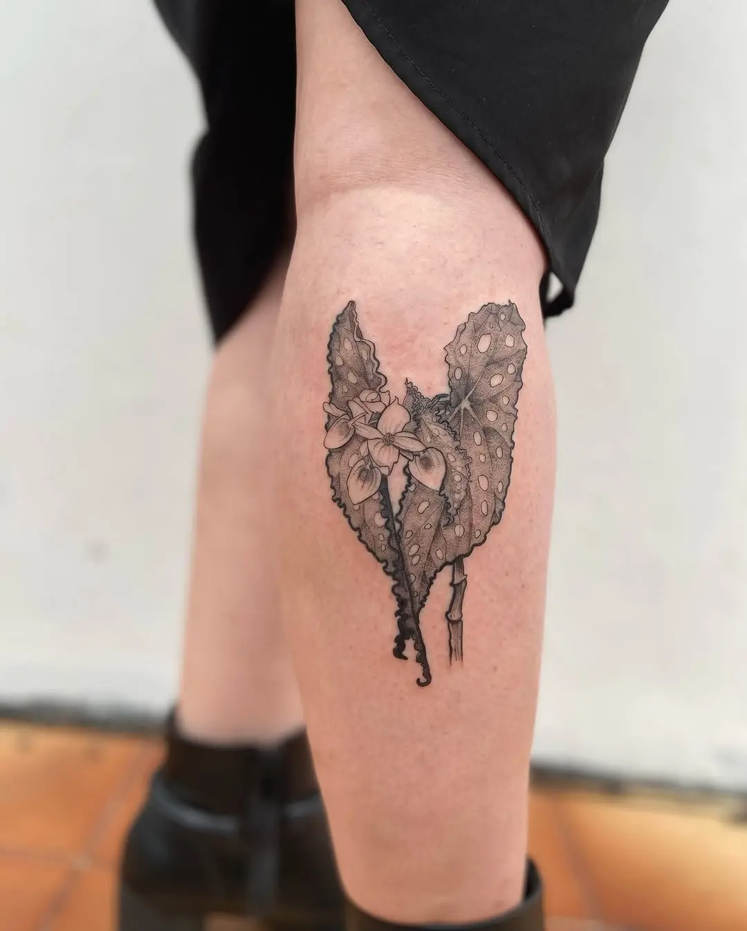 Elegant begonia tattoo design with heart shape