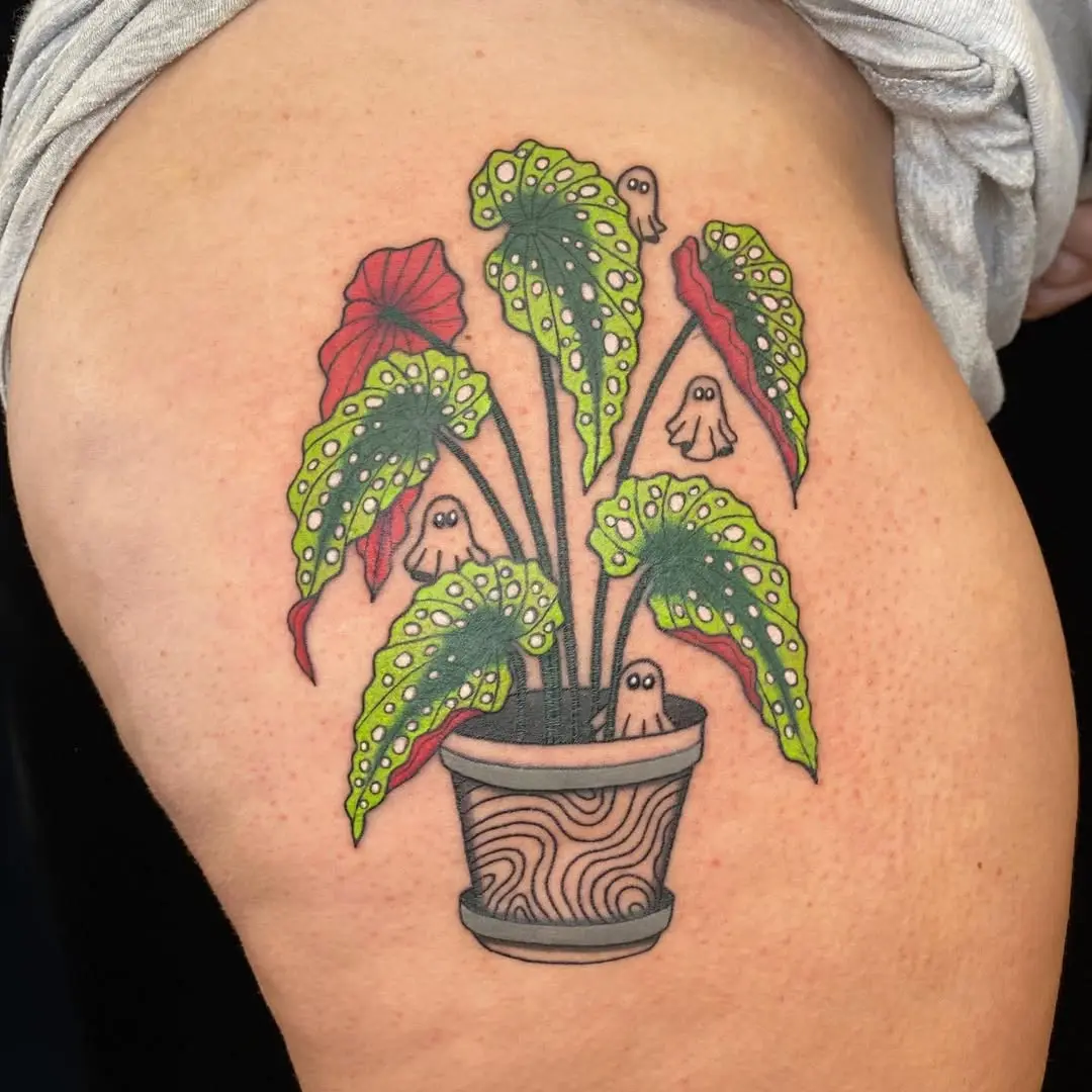 Whimsical begonia tattoo with playful ghosts