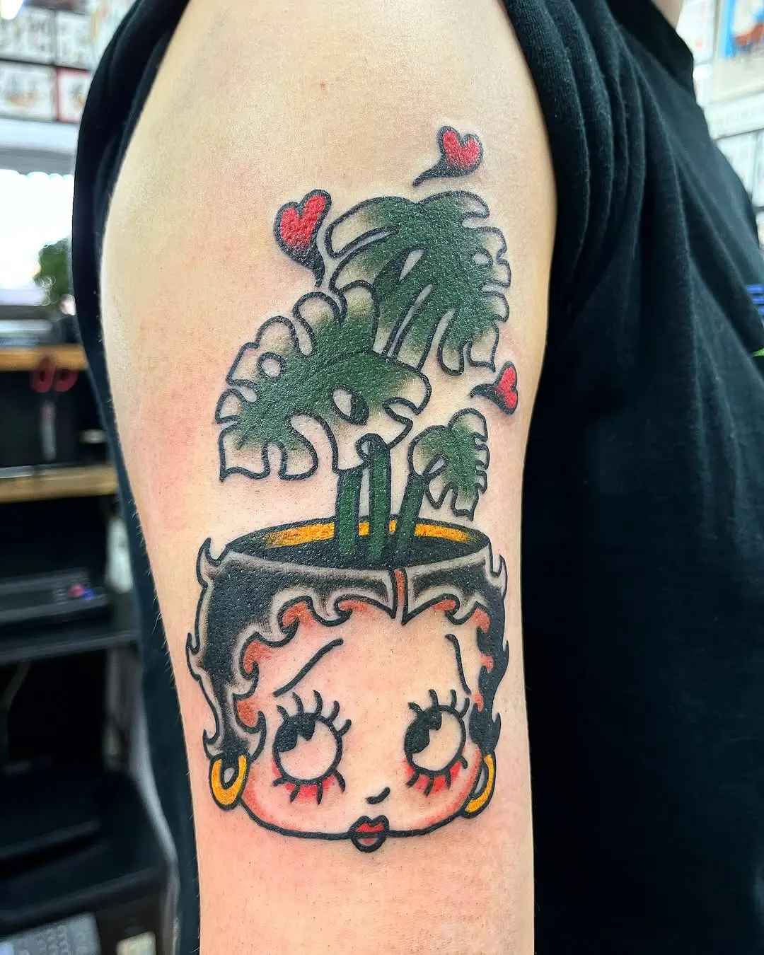 Playful Betty Boop Plant Tattoo Design
