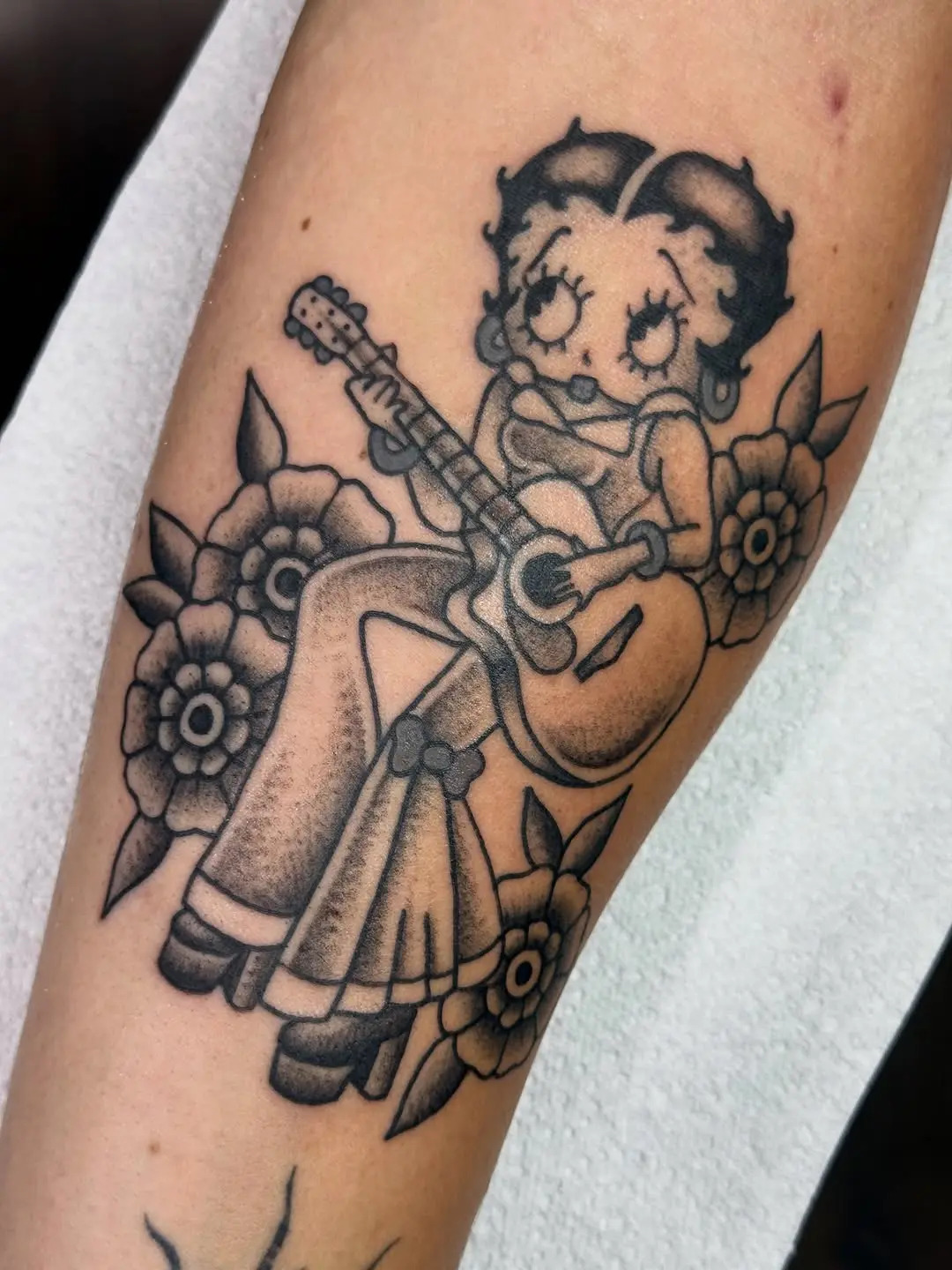 Charming Betty Boop Playing Guitar Tattoo