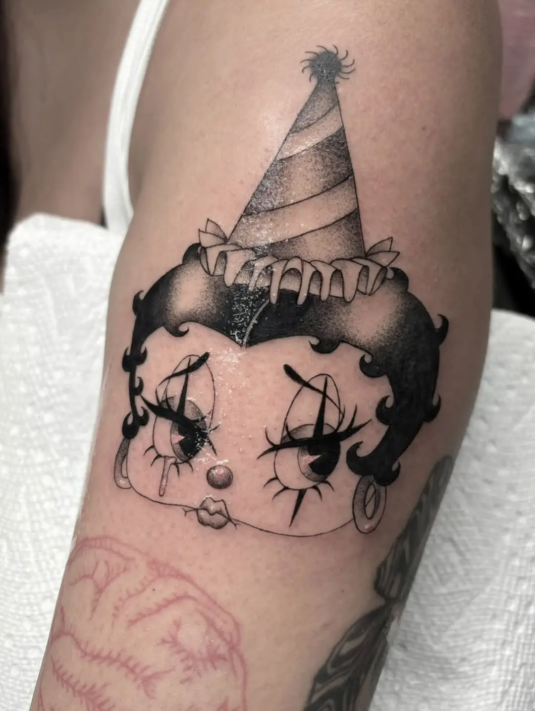 Charming Betty Boop Tattoo with Party Vibes