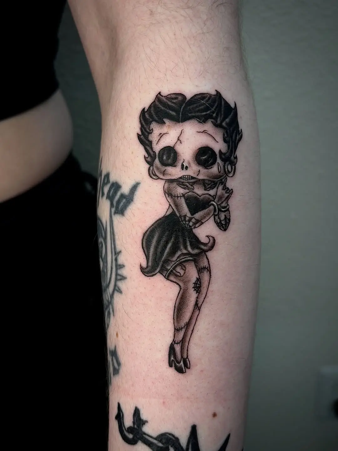 Charming Betty Boop Tattoo with Gothic Flair