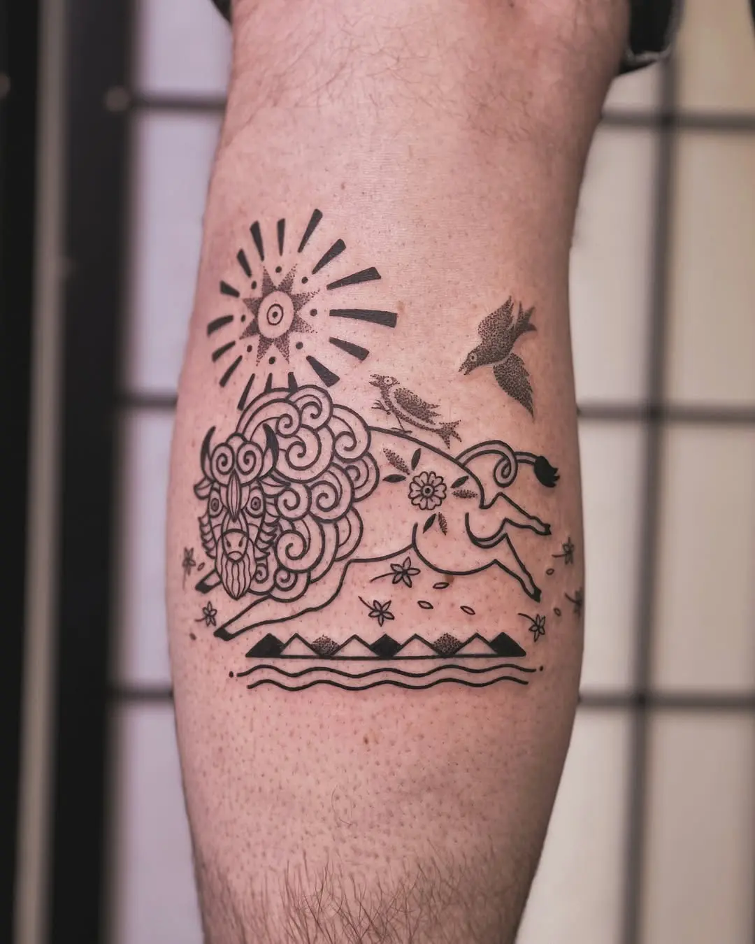 Stylized bison tattoo with intricate details