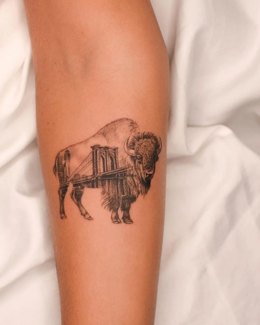 Unique bison tattoo merging nature and architecture