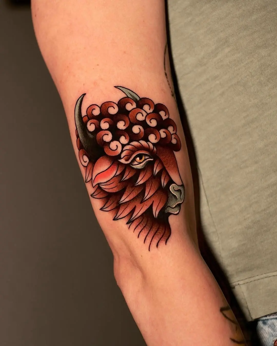 Vibrant bison tattoo with flowing design elements