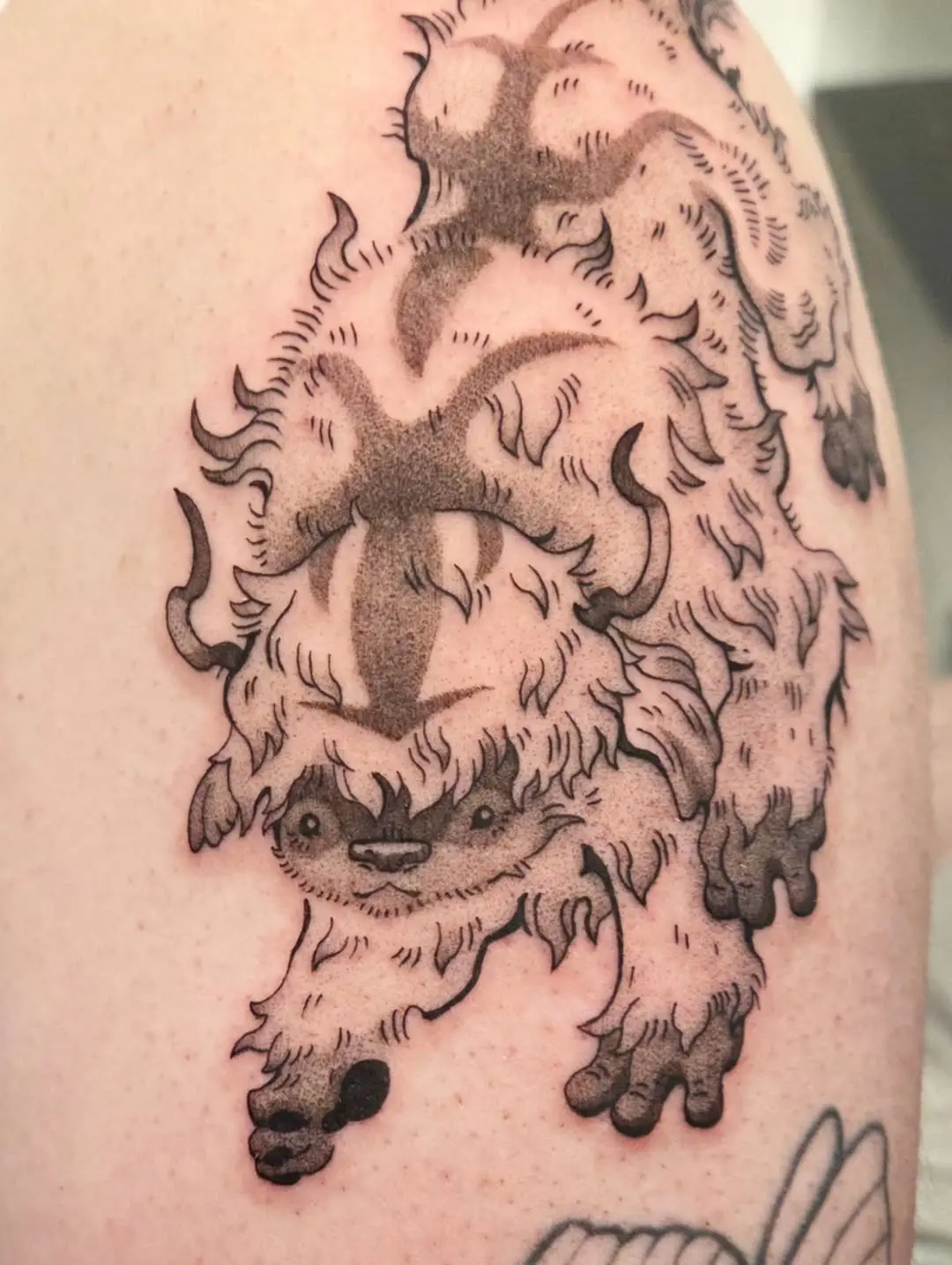 Whimsical bison tattoo with playful design