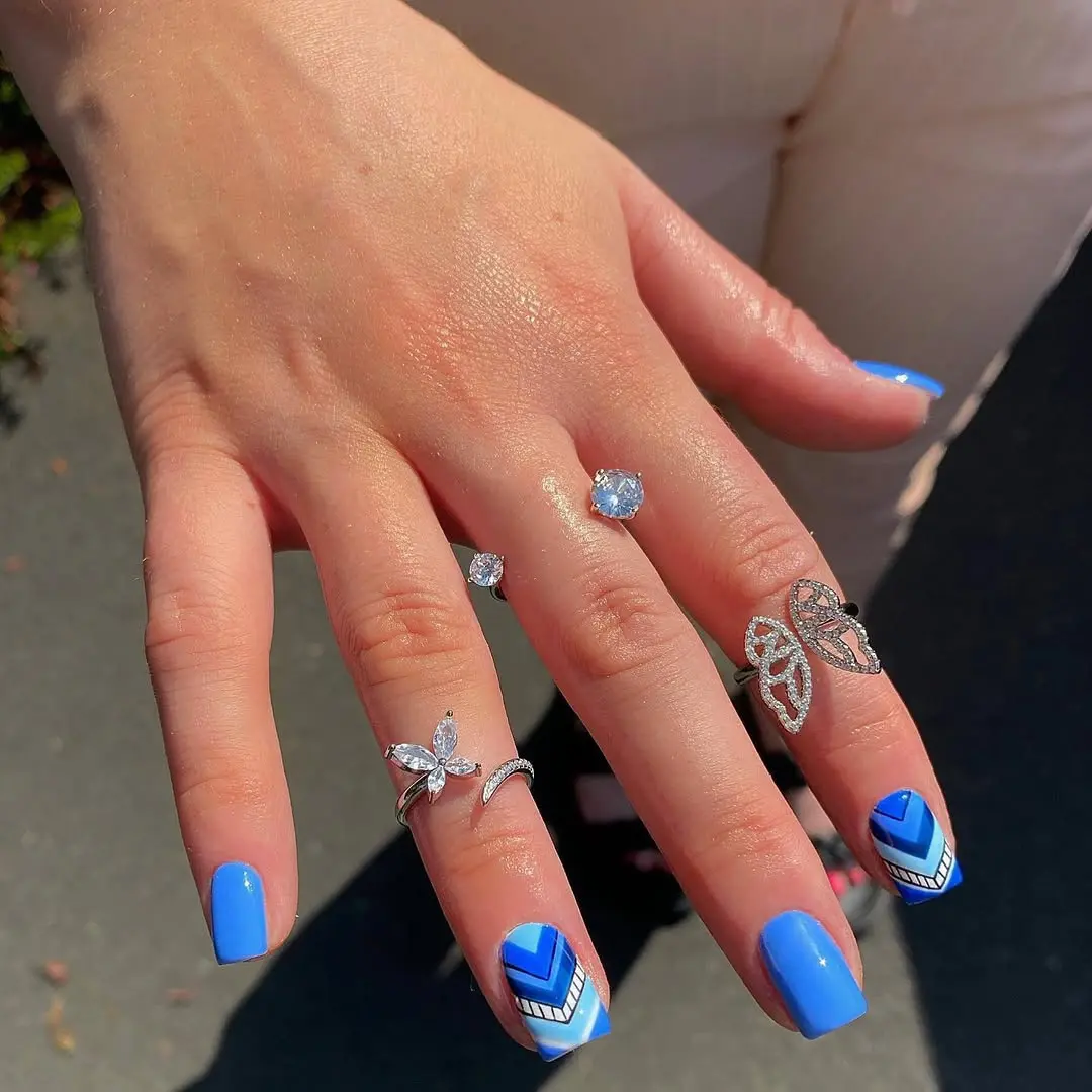 Stylish Blue Aztec Nails with Geometric Designs