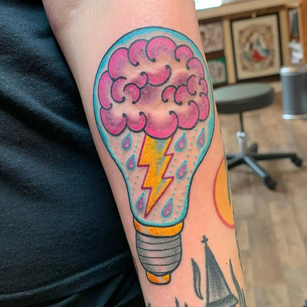 Colorful brain and lightbulb fusion tattoo design