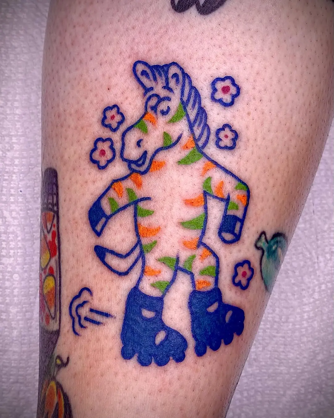 Whimsical zebra tattoo in vibrant colors