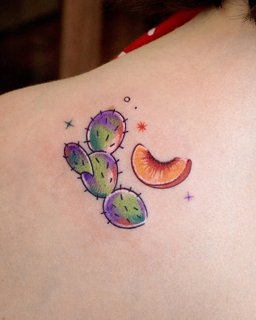 Vibrant cactus and peach tattoo design