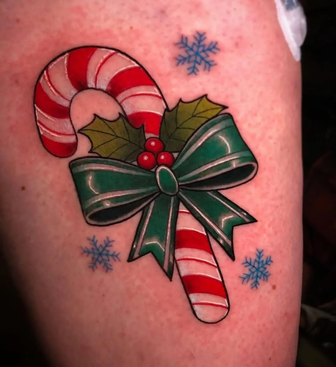 Festive candy cane tattoo with holiday vibes