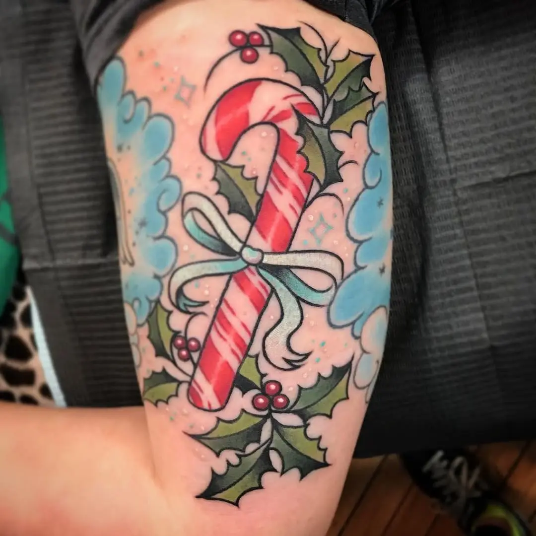 Festive Candy Cane Tattoo with Holly Accents