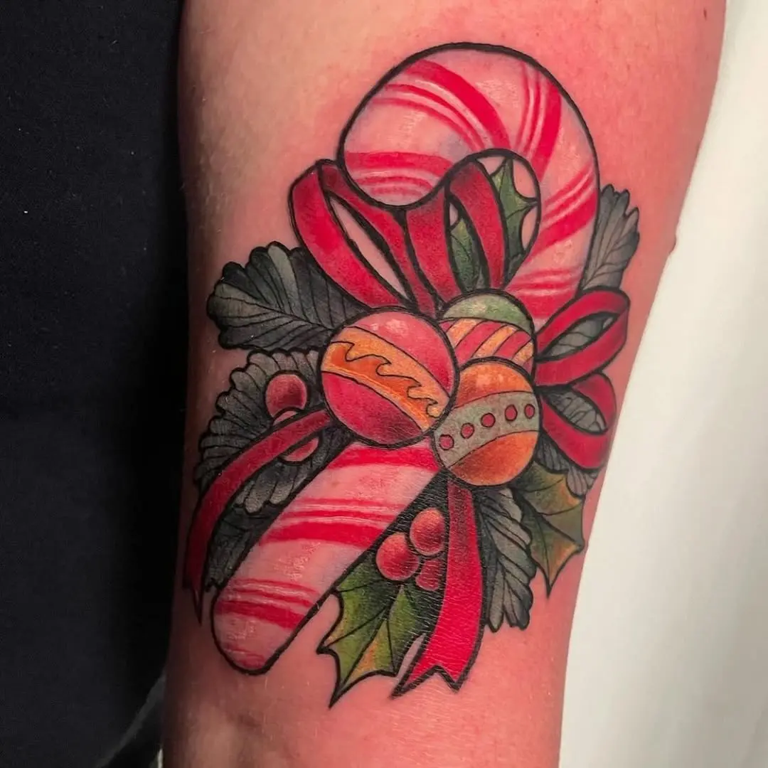 Festive candy cane tattoo with ornaments