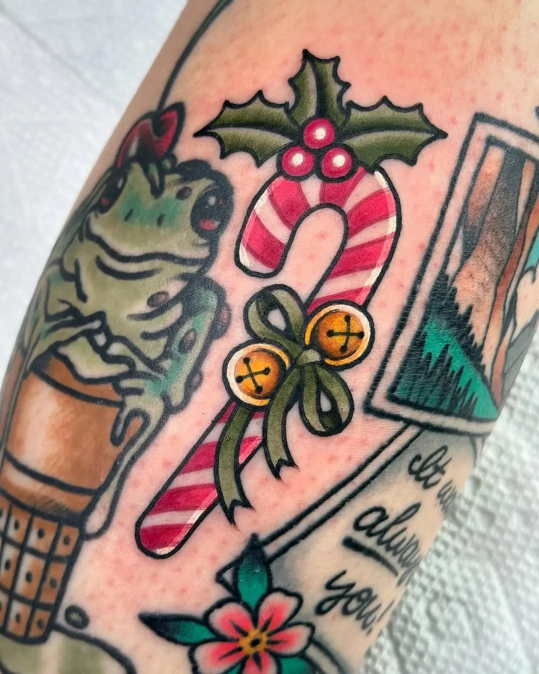 Whimsical candy cane tattoo with festive flair