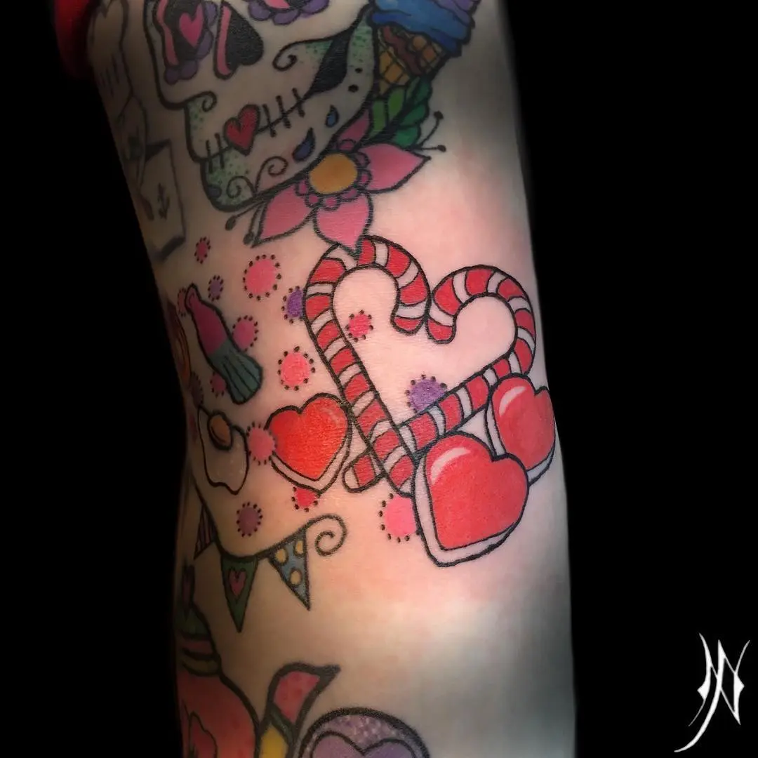 Charming candy cane tattoo with love hearts