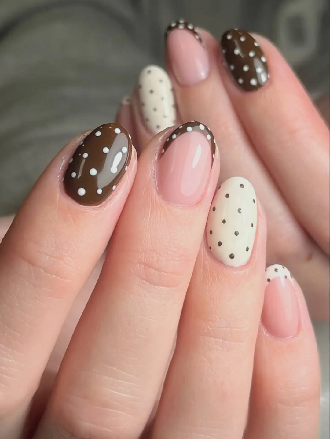 Stylish polka dot nails in brown and beige