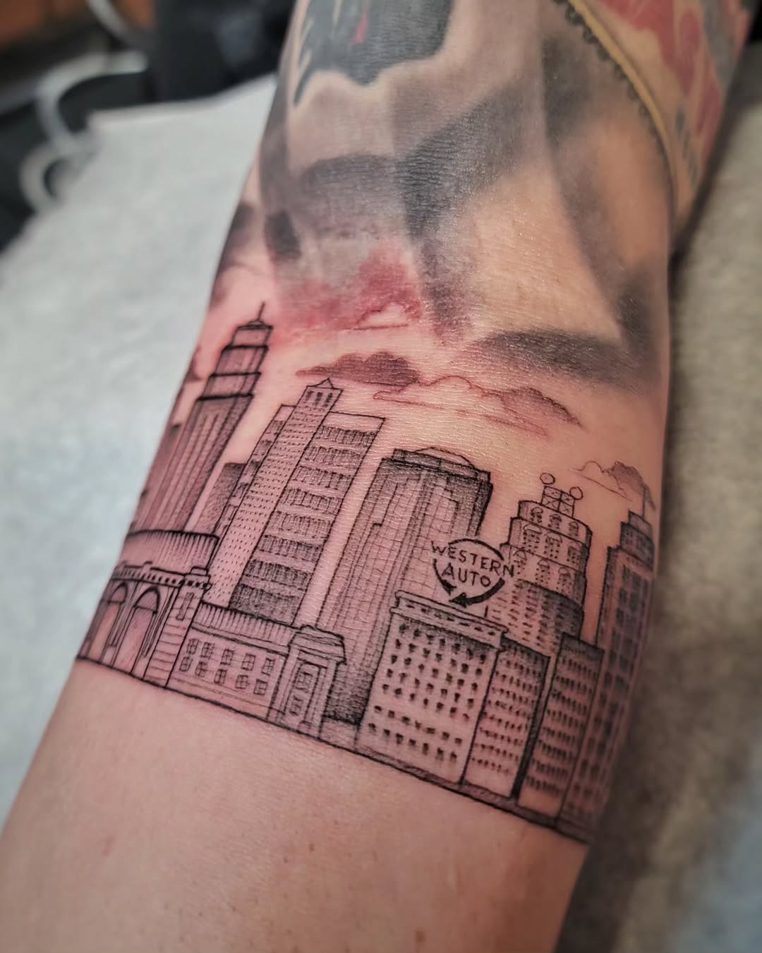 Intricate skyline tattoo in detailed linework